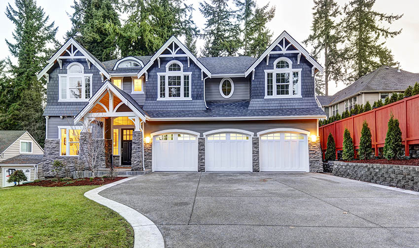 3 car garage with white doors and windows